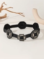 Detail of black leather belt featuring ornate silver buckles and decorative wavy edges - Black Spliced Belt - Silver Vintage Buckle