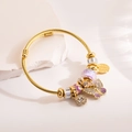 Gold cable bangle featuring purple butterfly charm and sparkling crystal beads for women - Purple