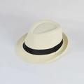 Detail of cream straw fedora hat featuring a black ribbon band and breathable mesh weave - Cream
