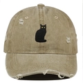 Detail of embroidered black cat patch on vintage distressed khaki cotton baseball cap - Khaki