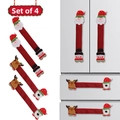 Detalle de un juego de 4 fundas decorativas de Navidad para manijas de refrigerador - Estilo de Dos Flores