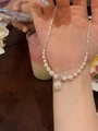 Elegant gold-plated double fishtail pearl necklace featuring zircon pendant on woman hand - 17# Necklace - Spliced Pearl Pendant Style