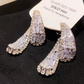 Macro shot of luxury sterling silver teardrop earrings with sparkling baguette zirconias - 22# Silver Irregular Zirconia Waterdrop Studs