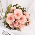 Beautiful artificial pink carnation bouquet with green leaves on white fabric background - Lotus root pink