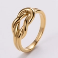 Detailed close-up of golden knot ring with smooth polished finish and spiral twist texture - US 6 / Twisted Knot / Gold