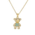Detail of gold-plated bear pendant necklace with blue crystals and sparkling zircons - Teal