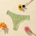 Close-up of light green ribbed fabric and white lace trim with a delicate bow detail - S(30) / Green