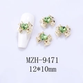 Golden bow nail charm with green heart gemstone showing 12x10mm size and application - Gold Base Emerald Green Heart (9471)
