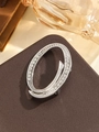 Elegant silver oval brooch with sparkling rhinestones on brown leather background - Silver Letter O