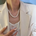 Elegant baroque pearl necklace worn by a model in a beige suit for a classic French style - 7# Necklace - White Round Pearl Style