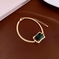 Detail of gold necklace with large square green zircon and tiny diamonds on silk - 9# Bracelet-Gold Green Gemstone Style