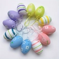 Uova di Pasqua colorate con motivi floreali e nastri su sfondo bianco - Stile D / Grande
