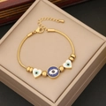 Gold snake chain bracelet featuring blue evil eye and white heart charms in a jewelry box - Blue Evil Eye and White Heart (1#)