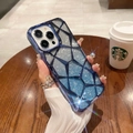 Close-up of diamond texture phone case with blue silver glitter in cafe setting - Blue Lattice + Glitter Paper / iPhone16promax
