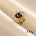 Detailed view of gold moon ring with black enamel disk showing 1.3cm width dimension - Stainless Steel-Black Enamel / Gold-Black Moon