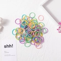 Colorful elastic hair ties for kids in pink, purple and yellow on a textured background - 2cm Nylon Ice Cream Colors