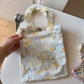 Detailed close-up of small floral cotton bag featuring metal snap buckle and fabric handles - Yellow Floral(T-19)