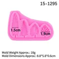 Pink silicone mold featuring four tropical leaf shapes for cake decorating and DIY crafts - Pink