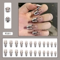 Macro view of 24pcs nude and white French press-on nails with black lace texture and gold dots - R581 Gradient Goddess