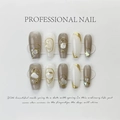 Detailed view of handmade press-on nails with gold foil, shell shards and wire accents - 542-Pearl Gold Edge