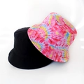 Detail showing solid black and vibrant tie-dye reversible bucket hat fabric texture - Pink Blue Yellow Tie Dye