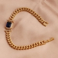 Detail of a gold-plated bracelet with blue square zircon and clear pavé on champagne silk - Royal Blue Zirconia