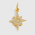 Macro shot of gold star pendant featuring sparkling zircons and a secure metal loop - Eight-pointed Star