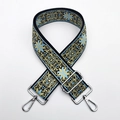 Close-up of thick ethnic jacquard strap with blue gold embroidery and silver metal clasps - Milan (Silver Buckle)