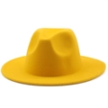 Detail of a bright ginger yellow wool felt fedora hat with a classic wide flat brim - Yellow