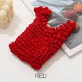 Vibrant red stretch bubble tote bag with 3D popcorn texture in minimalist setting - Red