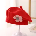 Detailed close-up of a red knit beret for girls featuring a 3D floral accent on a stand - 3-48 Months / Red