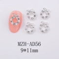 Macro view of Christmas wreath nail charms with silver bow, pearls, and rhinestones - Silver White Rhinestone Bow Wreath (AD56)