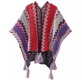 Close-up of colorful wave pattern knit poncho with tassel fringe detail on white background - New Red