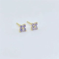 Detail of S925 sterling silver four-leaf clover stud earrings with purple zirconia crystals - Gold with Purple Zircon