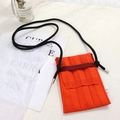 Detailed knit texture of orange accordion phone bag with black rope strap and tag - One Size / Orange Red Bag + Black Rope