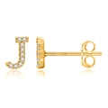Macro shot of S925 sterling silver stamp on golden J-shaped earring with zircon stones - Gold J