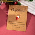 Christmas necklace with red glove pendant and Merry Christmas greeting card on red background - Christmas Mittens