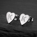 Minimalist heart-shaped stainless steel earring with engraved letter K on dark stone - Letter K / Steel