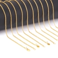 Close-up of multiple 2mm golden stainless steel O-link chains with lobster clasps - 45cm / Gold Color (NC2020)