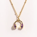 Detailed close-up of golden necklace featuring a purple enamel headphone shaped pendant - Purple Headphones