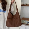 Minimalist brown large tote bag in soft PU leather shown from a stylish side view angle - Brown