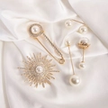 Detailed close-up of golden pearl and rhinestone brooches on luxury white silk fabric - No. 4 Starry Sky 5-Piece Set