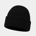 Close-up of black ribbed knit texture and cuffed hem on a classic winter beanie hat - One Size / Black