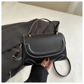 Detail of black small square handbag with white contrast stitching and gold metal buckle - Black