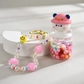 Quicksand bottle keychain with pink penguin charm and colorful beaded strap - Chain Style / Pink