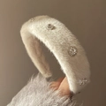 White plush headband with sparkling crystals and elegant silver ornaments for women - White