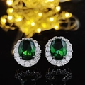 Elegant sterling silver stud earrings featuring green oval halo stones and small crystals - Green Diamond Oval Earrings Led-81