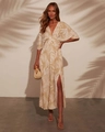 Detail of V-neck tropical print maxi dress with high side slit and palm leaf patterns - S / Camel