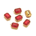 Macro detail of red rectangular step-cut gemstone pendant with gold-plated metal back - Single-Loop Style / Red