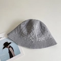 Macro detail of grey knit bucket hat showing premium braided cable patterns and texture - Light Gray
